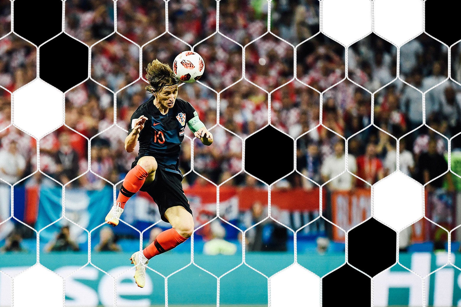 Croatia's midfielder Luka Modric heads the ball.