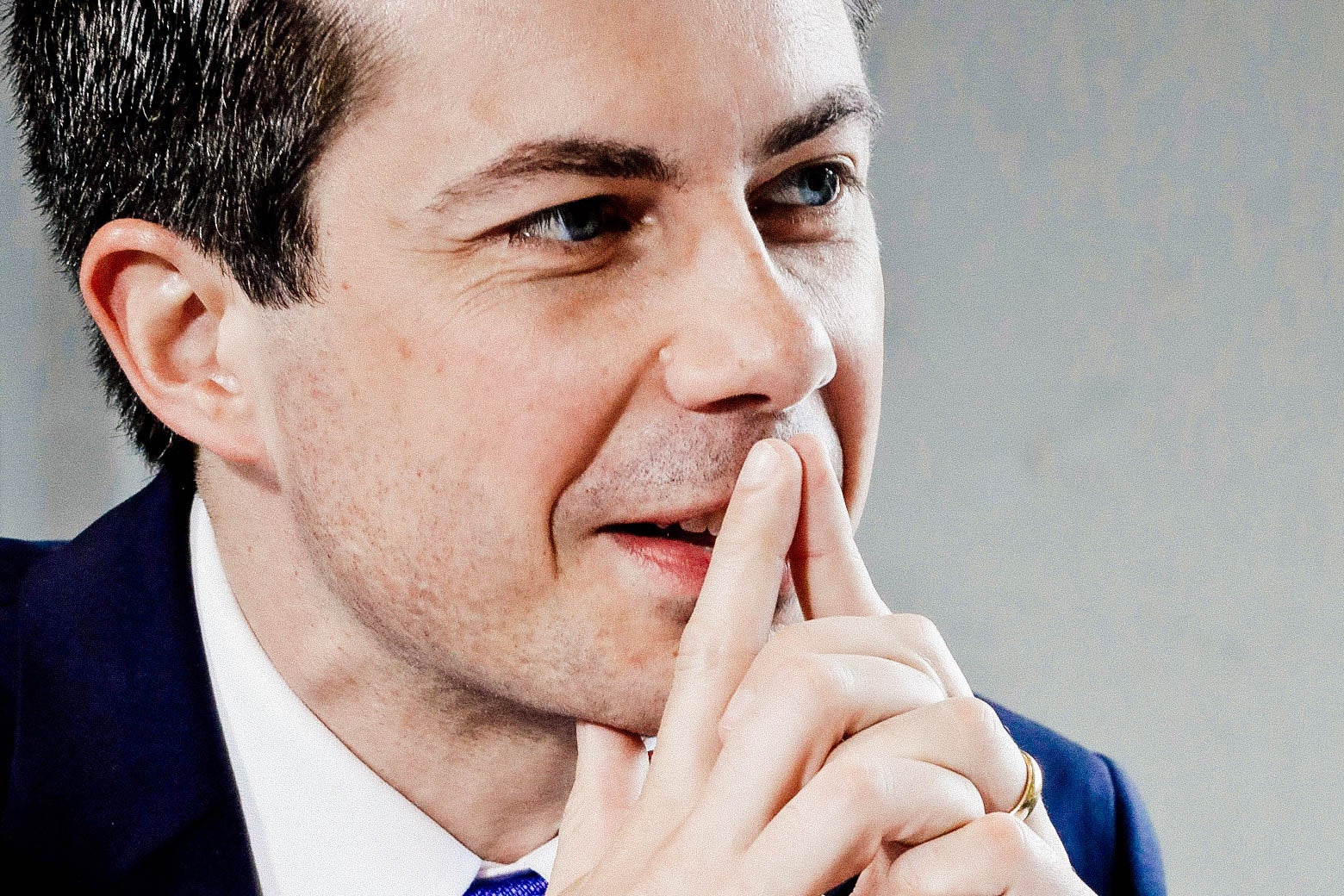 Pete Buttigieg holds tented fingers up to his face.