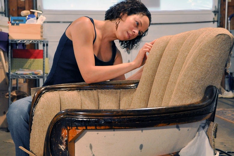Rachel Fletcher, the president of the National Upholstery Association, fixing a chair.