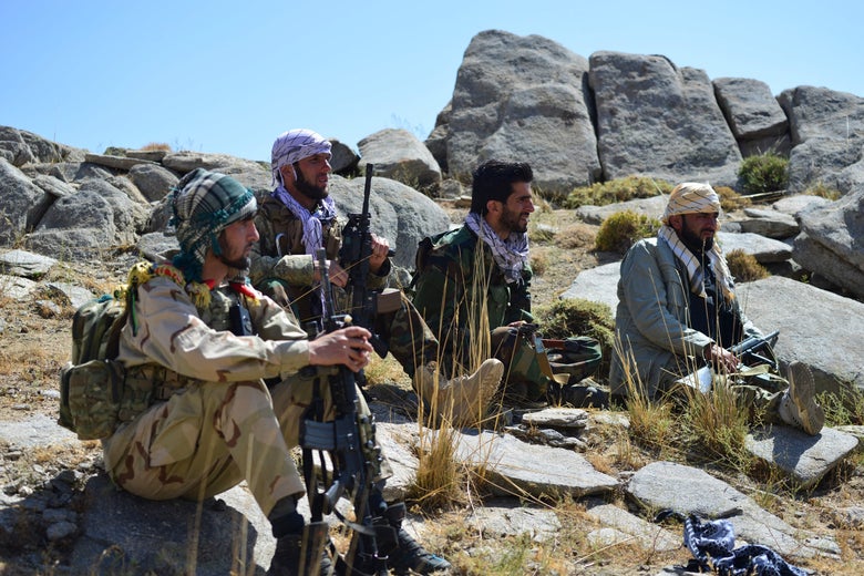 Afghan resistance movement and anti-Taliban uprising forces take rest as they patrol on a hilltop in Darband area in Anaba district, Panjshir province on September 1, 2021. 