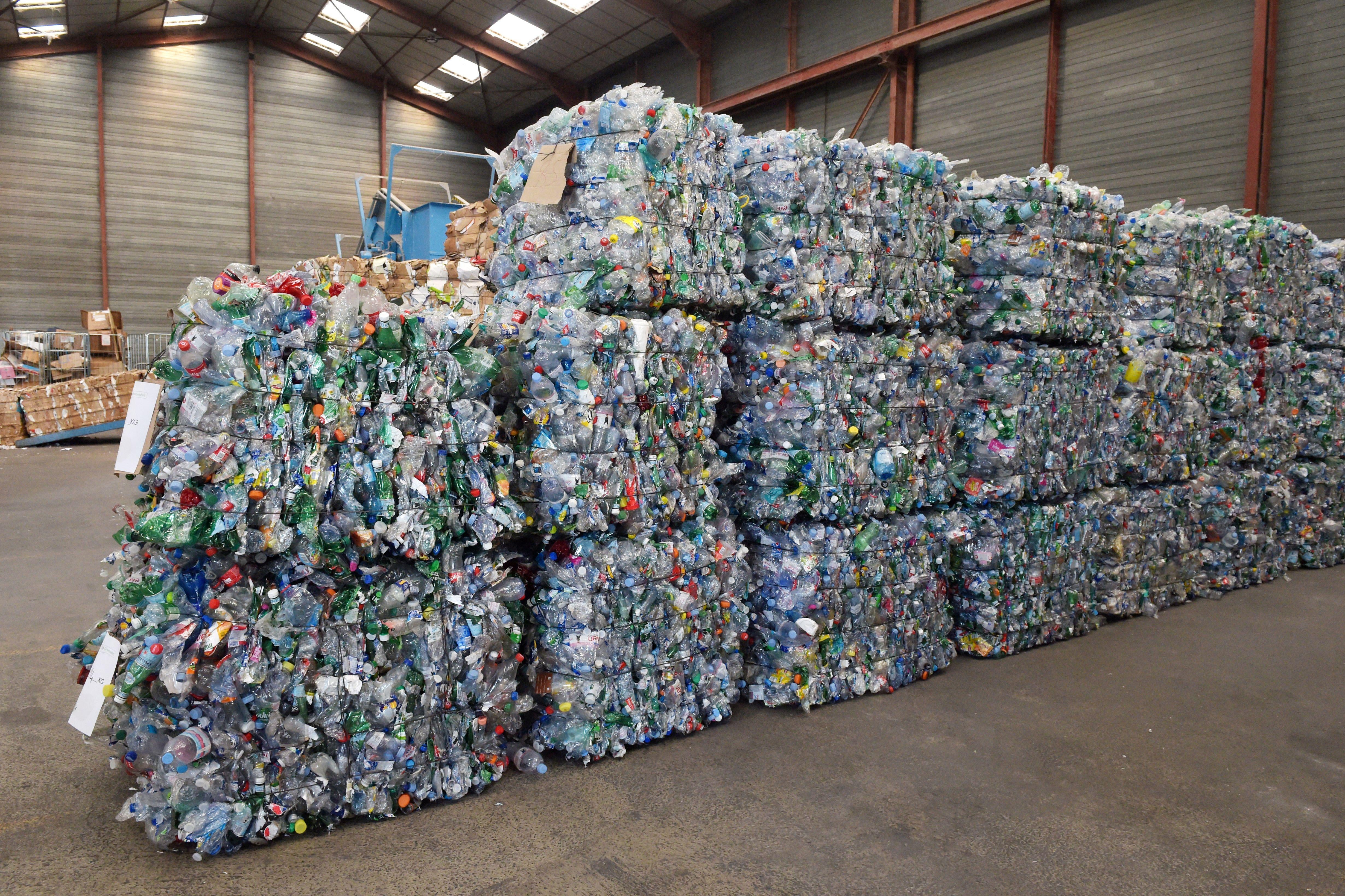 Piles of recyclable plastic bottles in a warehouse