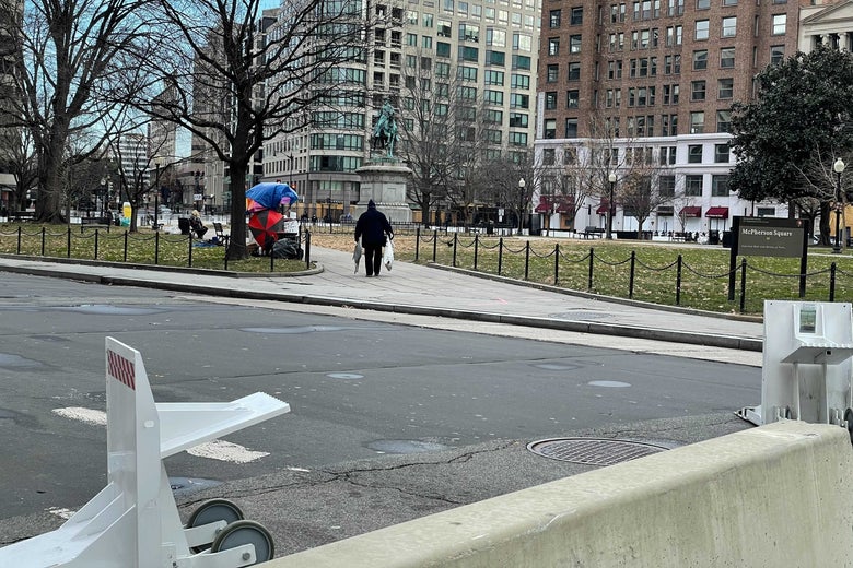 A lone Trump supporter walks off in the distance in D.C.