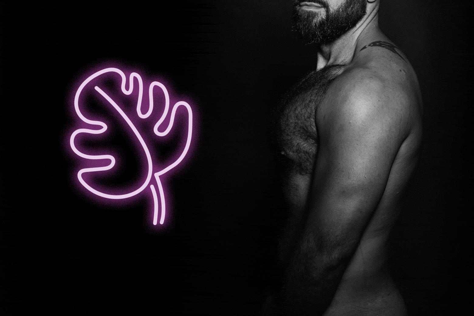 Naked man next to a leaf in neon.