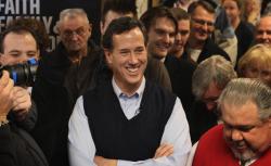 Republican presidential candidate former U.S. Senator Rick Santorum (R-PA) waits to be introduced during a campaign stop at the Daily Grind coffee shop on January 1, 2012 in Sioux City, Iowa.