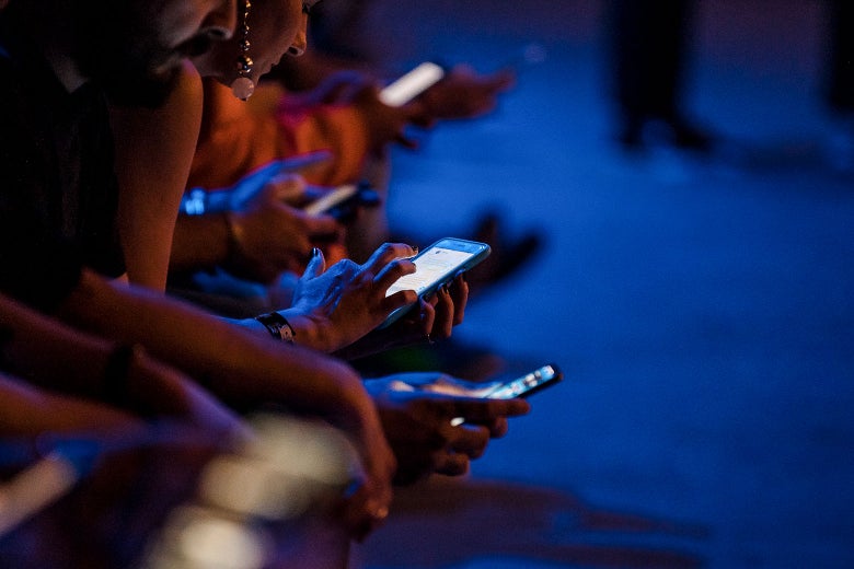 Audience members with cellphones out at Sao Paulo Fashion Week N46 SPFW Winter 2019