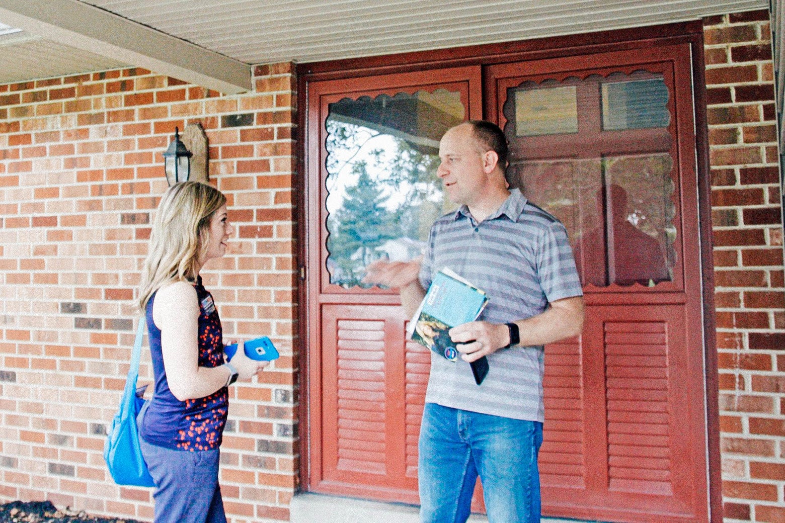 Pennsylvania state Senate candidate Katie Muth talks to Collegeville resident Nigel Piggott, who said he planned to support her.