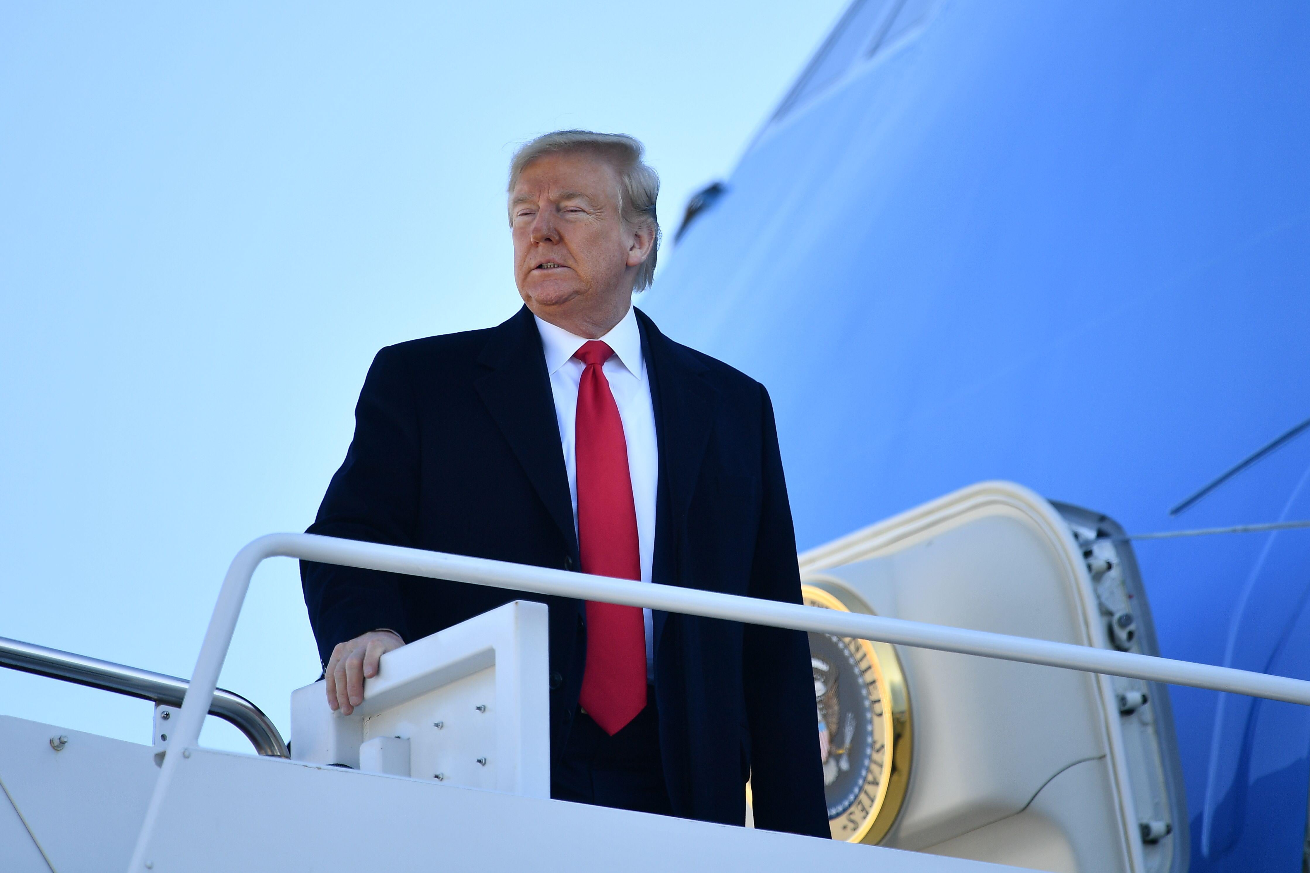 President Donald Trump boards Air Force One before departing from Andrews Air Force Base in Maryland on February 23, 2020.