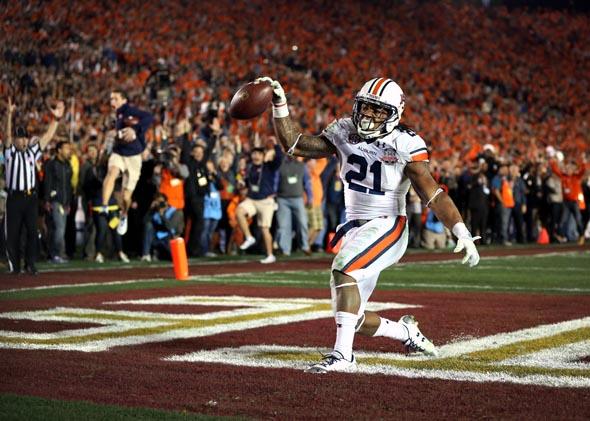 Auburn running back Tre Mason celebrates after scoring a fourth-quarter touchdown to take the lead in the BCS title game on Jan. 6, 2014. 