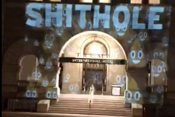 A screen grab of video posted on Twitter showing the word "SHITHOLE" projected onto the Trump International Hotel in Washington, D.C. on January 14, 2017. 