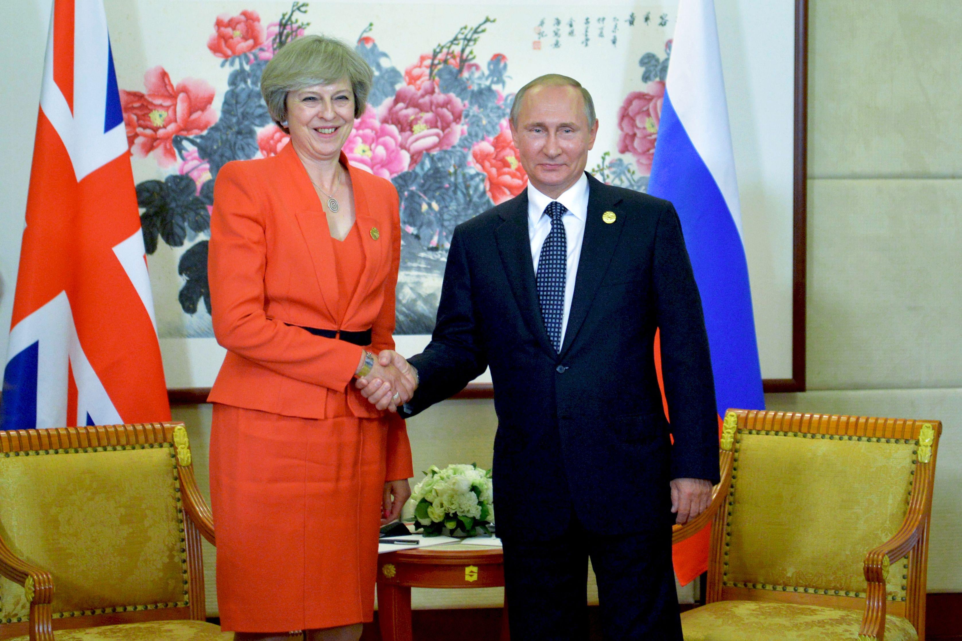 Russian President Vladimir Putin (R) meets with Britain's Prime Minister Theresa May on the sidelines of the G20 Leaders Summit in Hangzhou on September 4, 2016. / AFP / SPUTNIK / ALEXEI DRUZHININ        (Photo credit should read ALEXEI DRUZHININ/AFP/Getty Images)