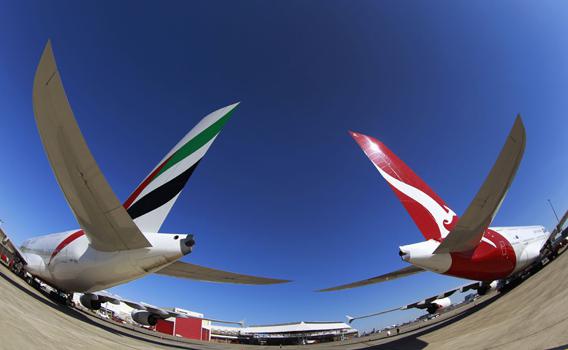 Emirates and Qantas A380 aircraft sit on the tarmac at Kingsford Smith international airport in Sydney September 6, 2012.
