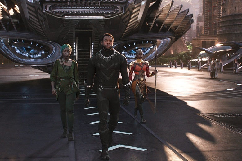 Three characters from Black Panther walk out of a space ship.