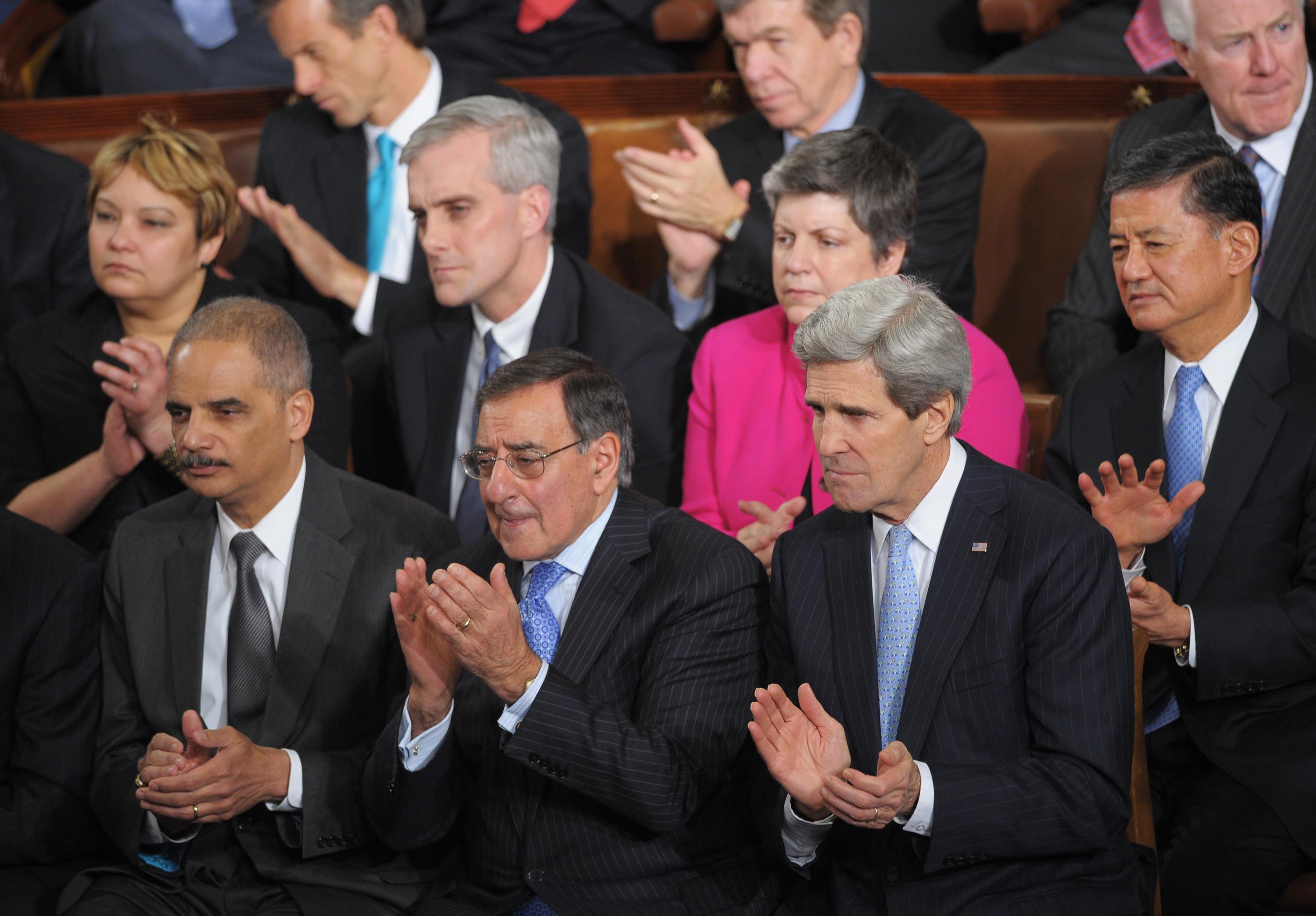 (Front row) Attorney General Eric Holder, outgoing Defense Secretary Leon Panetta, Secretary of State John Kerry, EPA Administrator Lisa Jackson, White House Chief of Staff Denis McDonough, Homeland Security Secretary Janet Napolitano and Veterans Affairs Secretary Eric Shinseki applaud as President Barack Obama delivers his State of the Union address before a joint session of Congress on February 12, 2013, at the U.S. Capitol in Washington, D.C.