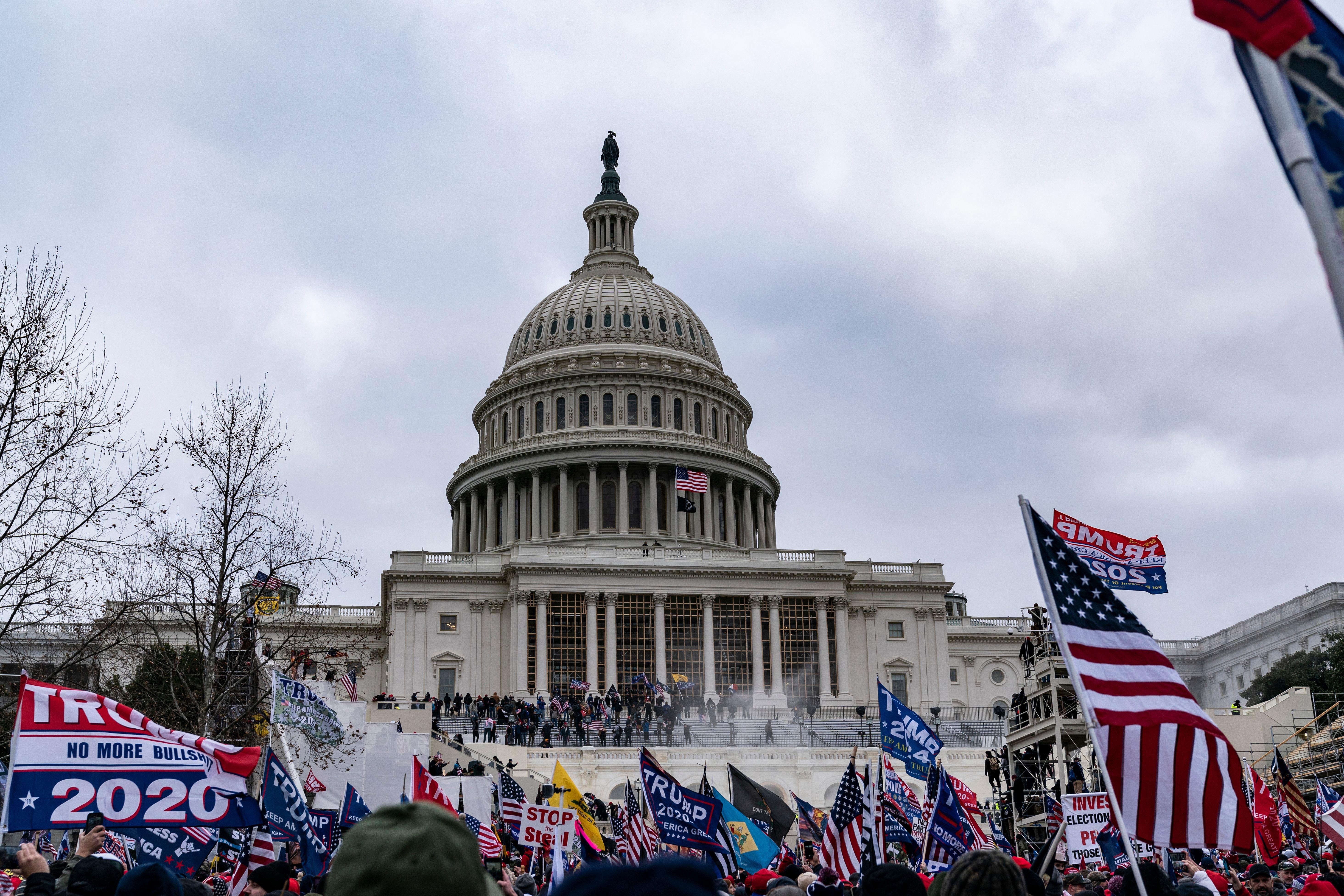Supporters of US President Donald Trump protest outside the US Capitol on January 6, 2021, in Washington, DC. - Demonstrators breeched security and entered the Capitol as Congress debated the a 2020 presidential election Electoral Vote Certification. (Photo by ALEX EDELMAN / AFP) (Photo by ALEX EDELMAN/AFP via Getty Images)