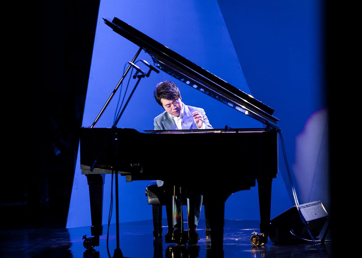 Pianist Lang Lang performs during a concert.