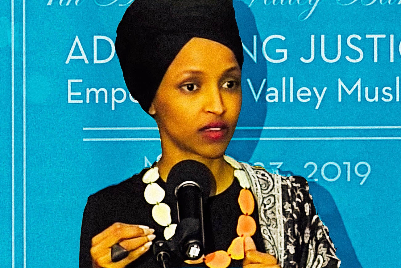 Ilhan Omar at a microphone.