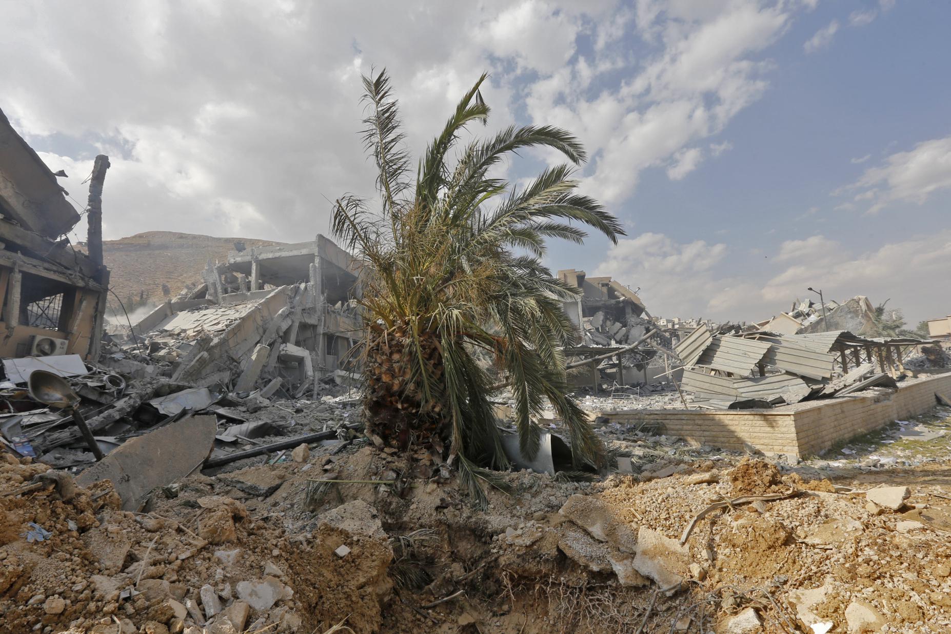 This picture taken on April 14, 2018 shows the wreckage of a building described as part of the Scientific Studies and Research Centre (SSRC) compound in the Barzeh district, north of Damascus, during a press tour organised by the Syrian information ministry.
The United States, Britain and France launched strikes against Syrian President Bashar al-Assad's regime early on April 14 in response to an alleged chemical weapons attack after mulling military action for nearly a week. Syrian state news agency SANA reported several missiles hit a research centre in Barzeh, north of Damascus, 'destroying a building that included scientific labs and a training centre'. / AFP PHOTO / Louai Beshara        (Photo credit should read LOUAI BESHARA/AFP/Getty Images)