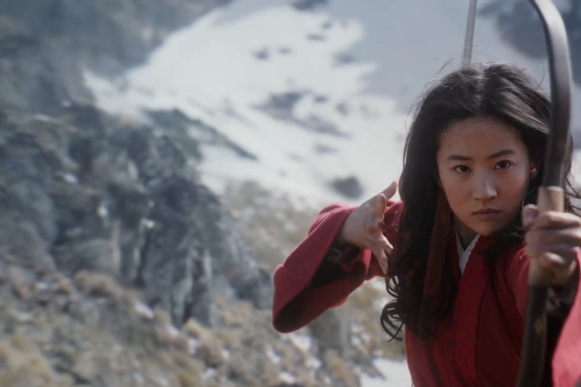 Liu Yifei looses an arrow at the camera in a still from Mulan.
