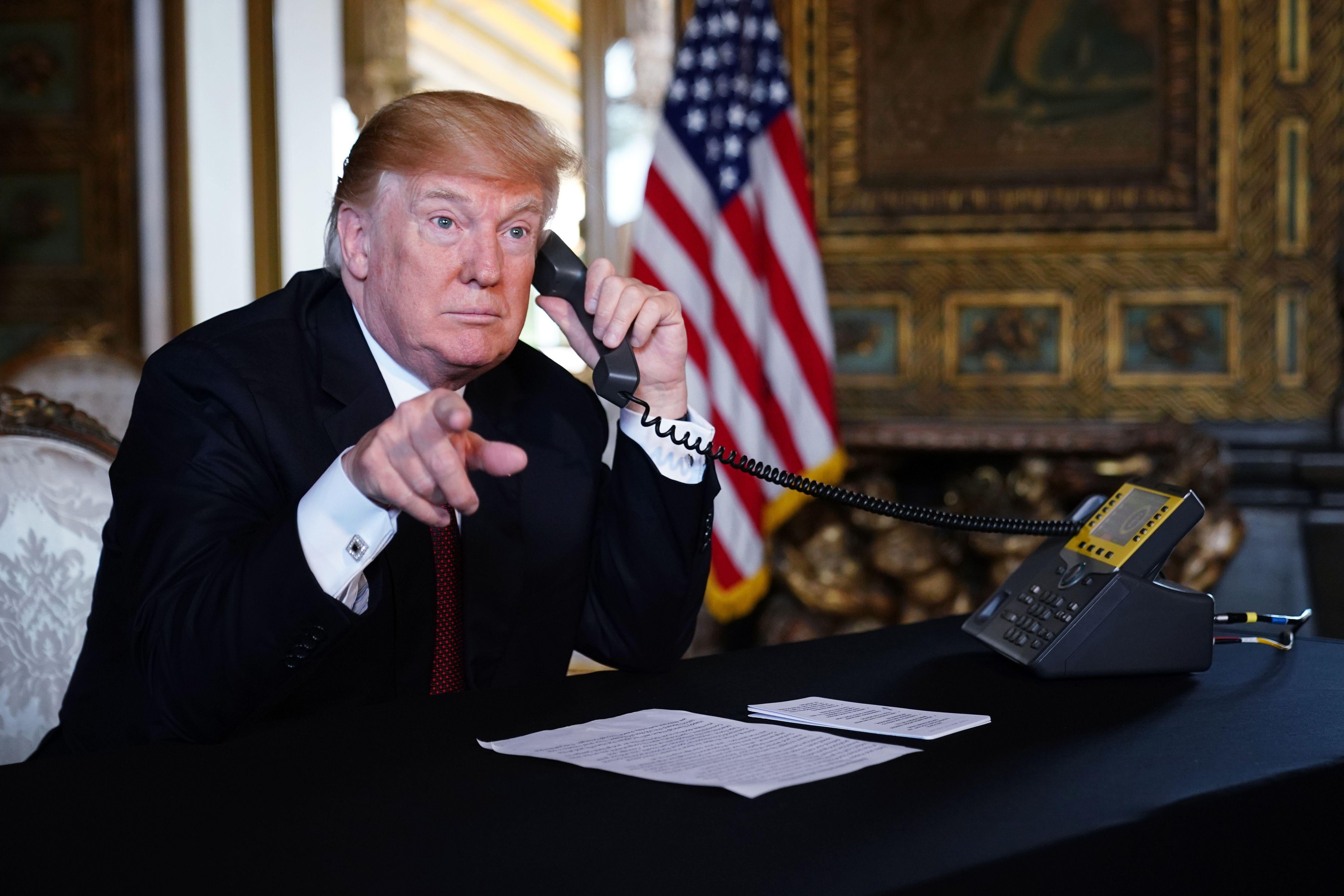 President Donald Trump speaks to members of the military via teleconference from his Mar-a-Lago resort in Palm Beach, Florida, on Thanksgiving Day, November 22, 2018.