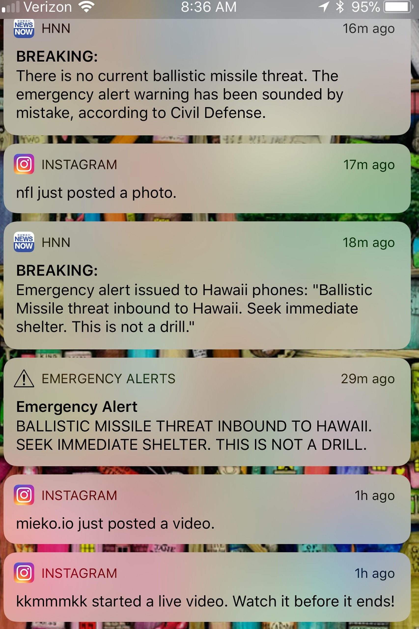 This photo illustration screenshot taken by the photographer of his cell phone shows messages of emergency alerts on January 13, 2018 of Honolulu, Hawaii. 
Social media ignited on January 13, 2018 after apparent screenshots of cell phone emergency alerts warning of a 'ballistic missile threat inbound to Hawaii' began circulating, which US officials quickly dismissed as 'false.''Hawaii - this is a false alarm,' wrote Democratic Representative Tulsi Gabbard on Twitter. 'I have confirmed with officials there is no incoming missile.' The Hawaii Emergency Management Agency also confirmed there is 'NO missile threat to Hawaii.' US military spokesman David Benham said the US Pacific Command 'has detected no ballistic missile threat to Hawaii. Earlier message was sent in error,' adding that the US state would 'send out a correction message as soon as possible.'
 / AFP PHOTO / Eugene Tanner        (Photo credit should read EUGENE TANNER/AFP/Getty Images)