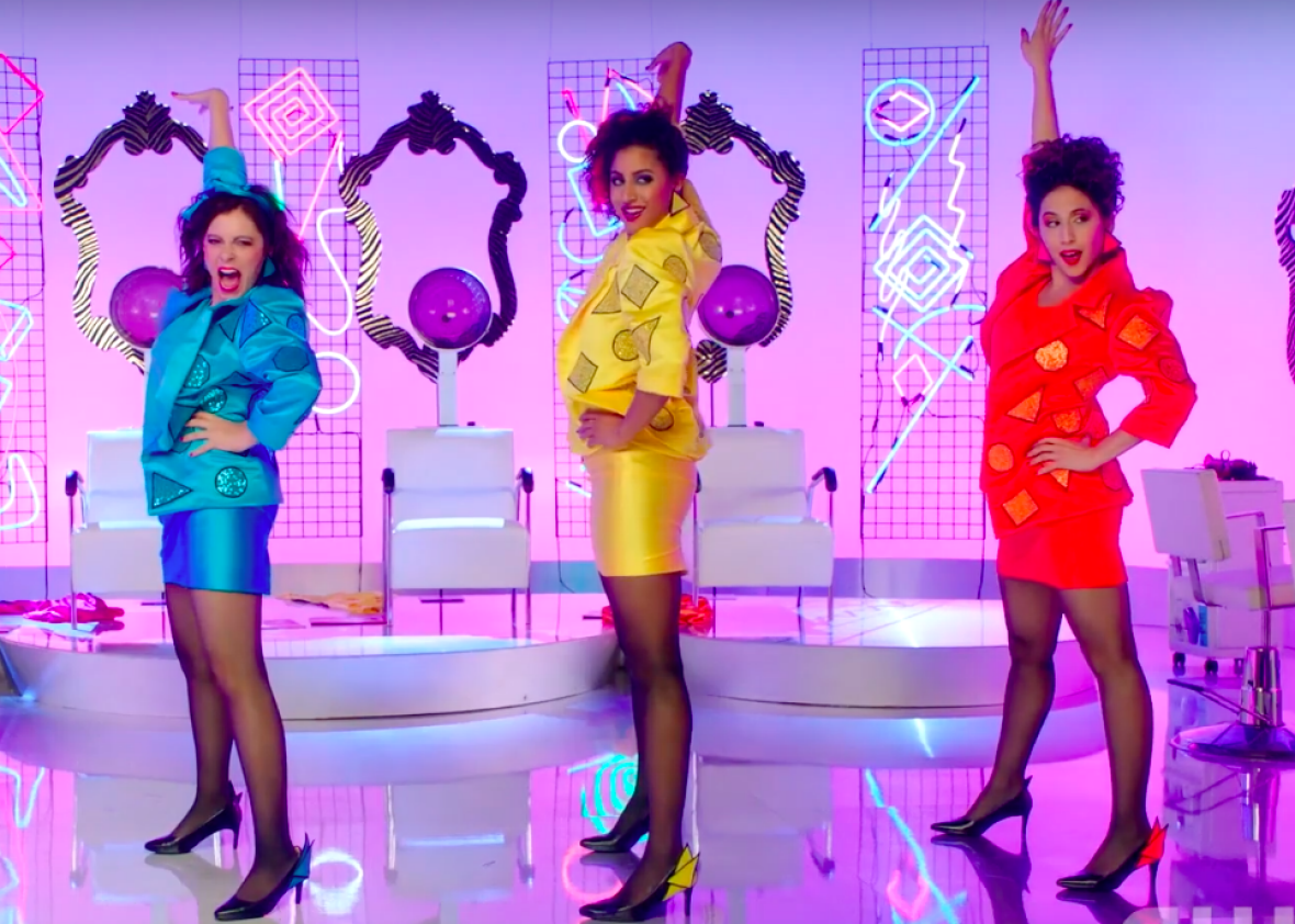 Three candy-colored women standing hands on their hips girl group style