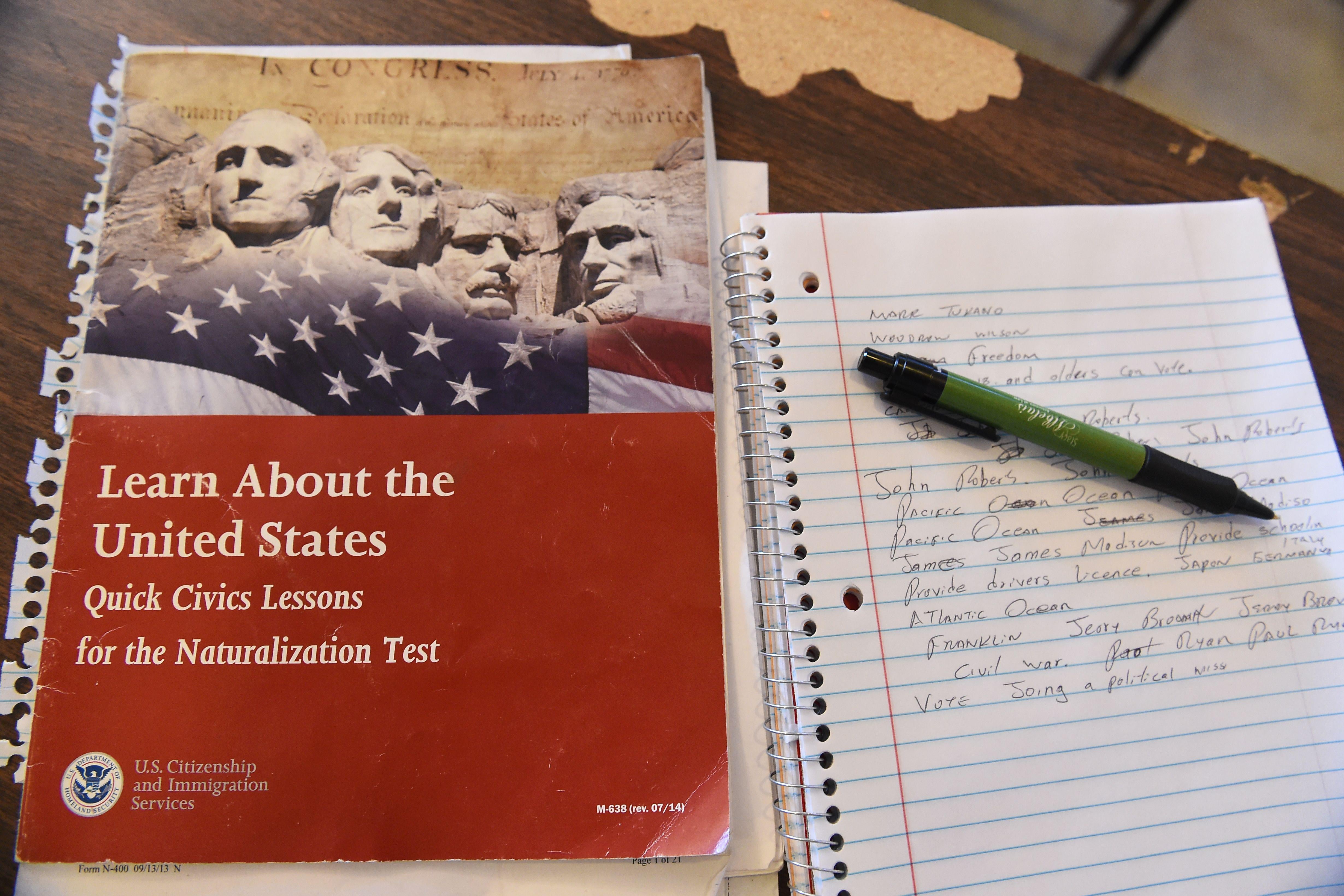 A U.S. citizenship test review booklet and notes are seen during a citizenshipt test prearation class in Perris, California, June 16, 2016. The 11 million undocumented immigrants in the United States are at the heart of a contentious debate that has stirred up passions and become a defining issue in the US presidential race, leading many immigrants who are eligible to become US citizen to take the step necessary to obtain their citizenship so they can vote in the November election. / AFP / ROBYN BECK        (Photo credit should read ROBYN BECK/AFP via Getty Images)