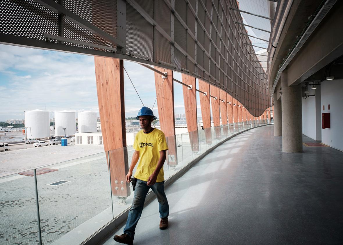 A worker walks at the Carioca Arena 2 at the Olympic Park in Rio de Janeiro, Brazil, on May 14, 2016, during its inauguration.