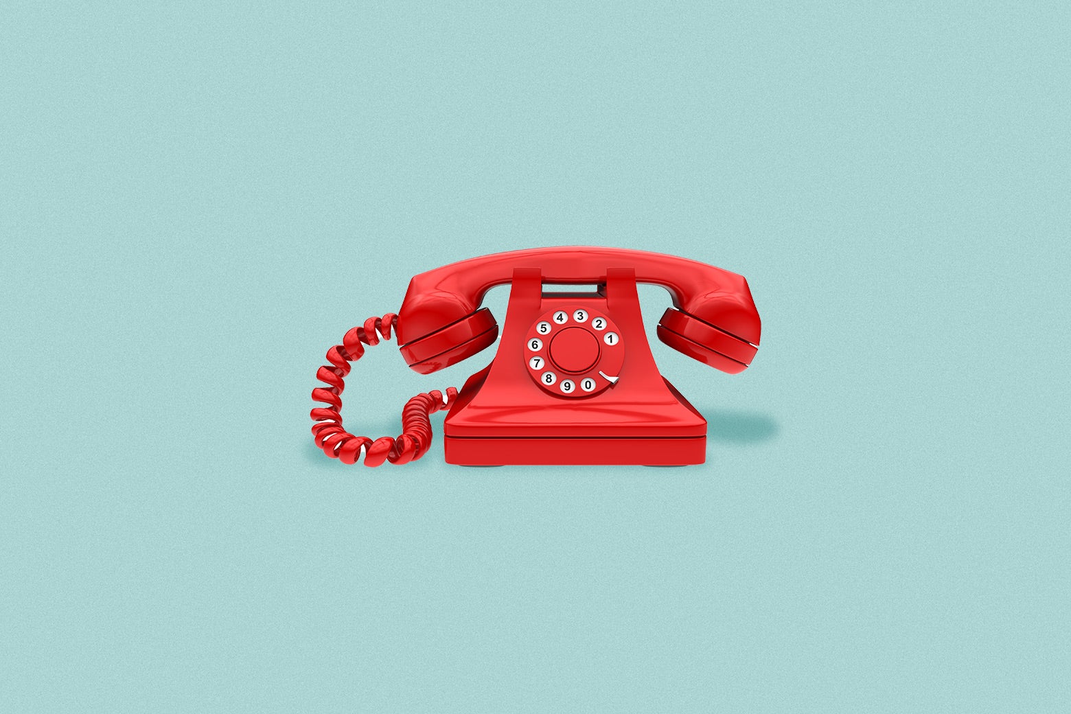 there is a red telephone sitting on a blue surface