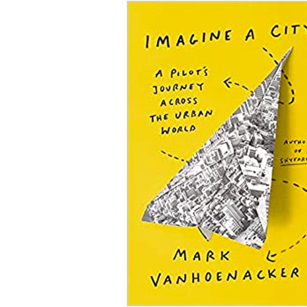 The book jacket showing the title and author, with a black and white map of a city folded into a paper airplane at its center