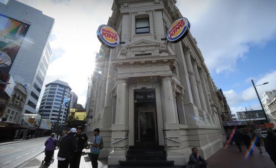 Burger King signs adorn a Victorian-era building on a street in Wellington, Sept. 8, 2011