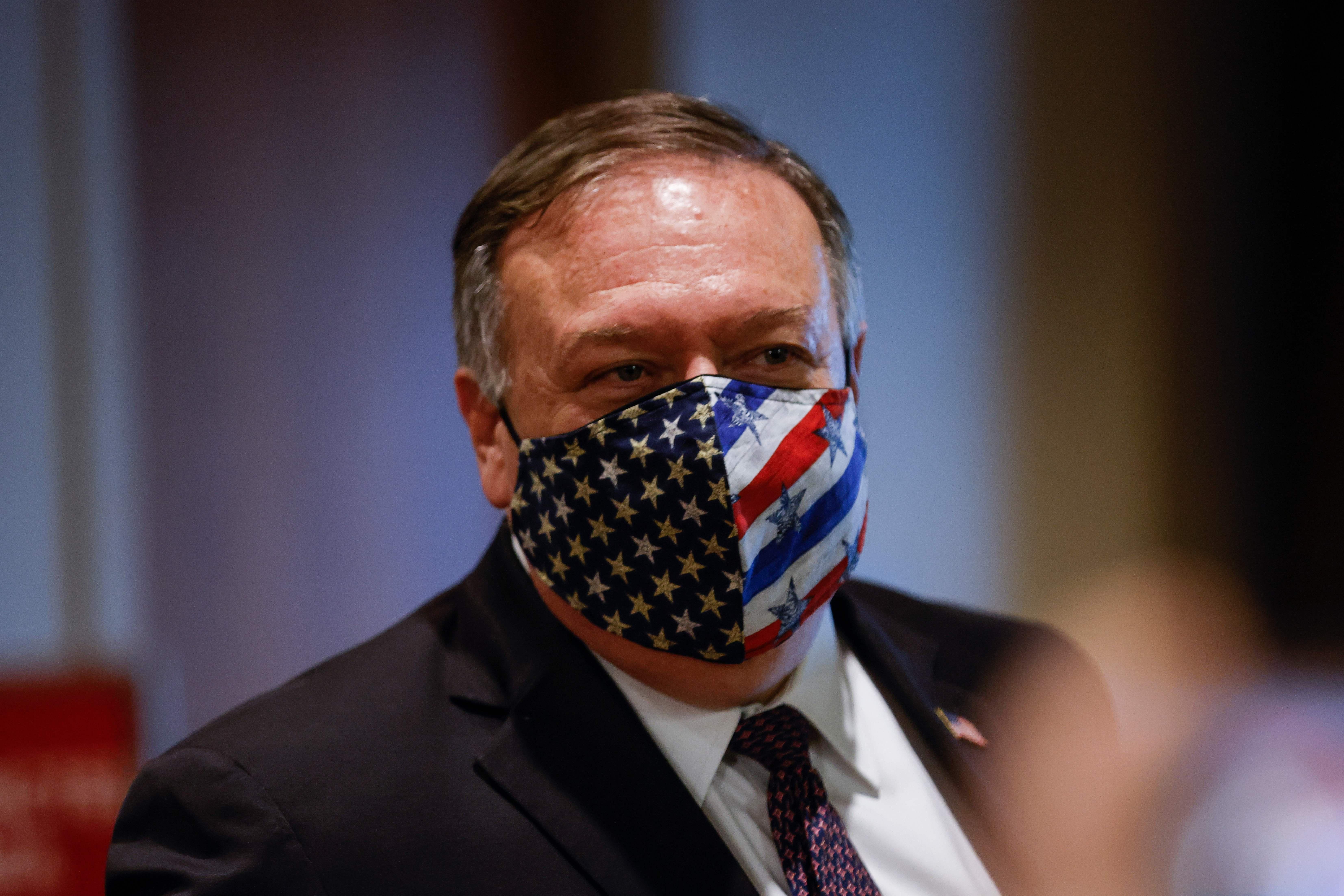 Pompeo wearing an American flag mask.
