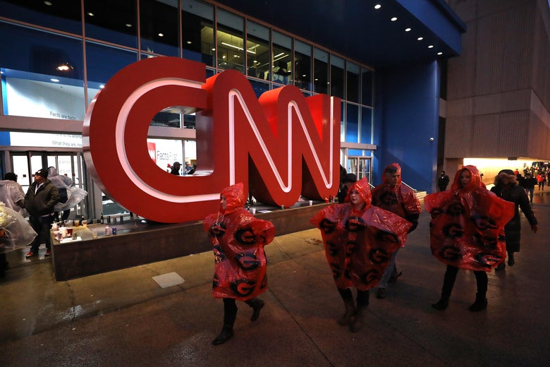  People walk past the CNN Center on January 8, 2018 in Atlanta, Georgia. 