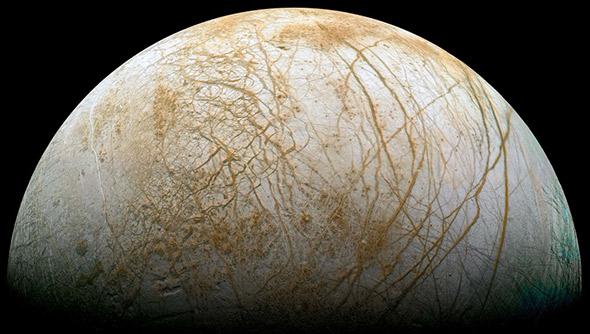 Icy slush from a hidden ocean erupting into fractures in Europa, one of Jupiter's Galilean moons.