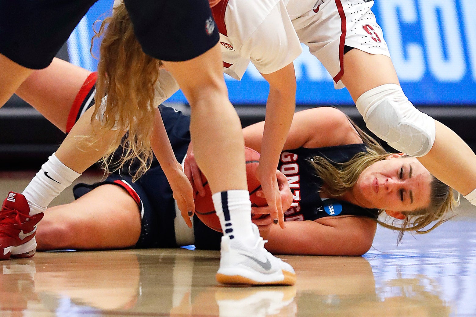 Gonzaga forward Jill Barta, bottom, battles for a loose ball against Stanford guard Brittany McPhee.