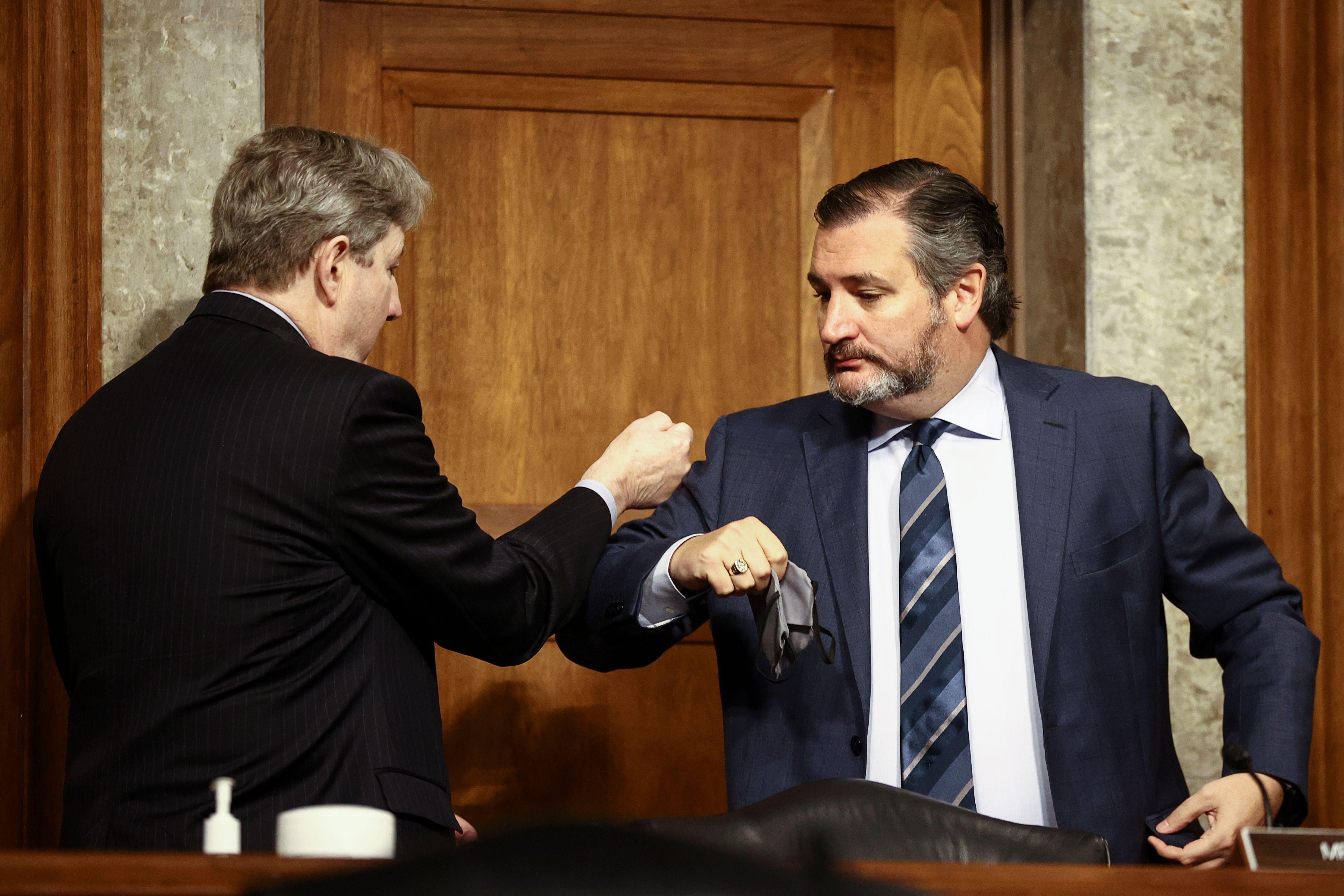 Senator John Kennedy (R-LA) and Senator Ted Cruz (R-TX) share an elbow bump greeting at a Senate Judiciary Committee hearing on Capitol Hill in Washington, D.C. on November 17, 2020.