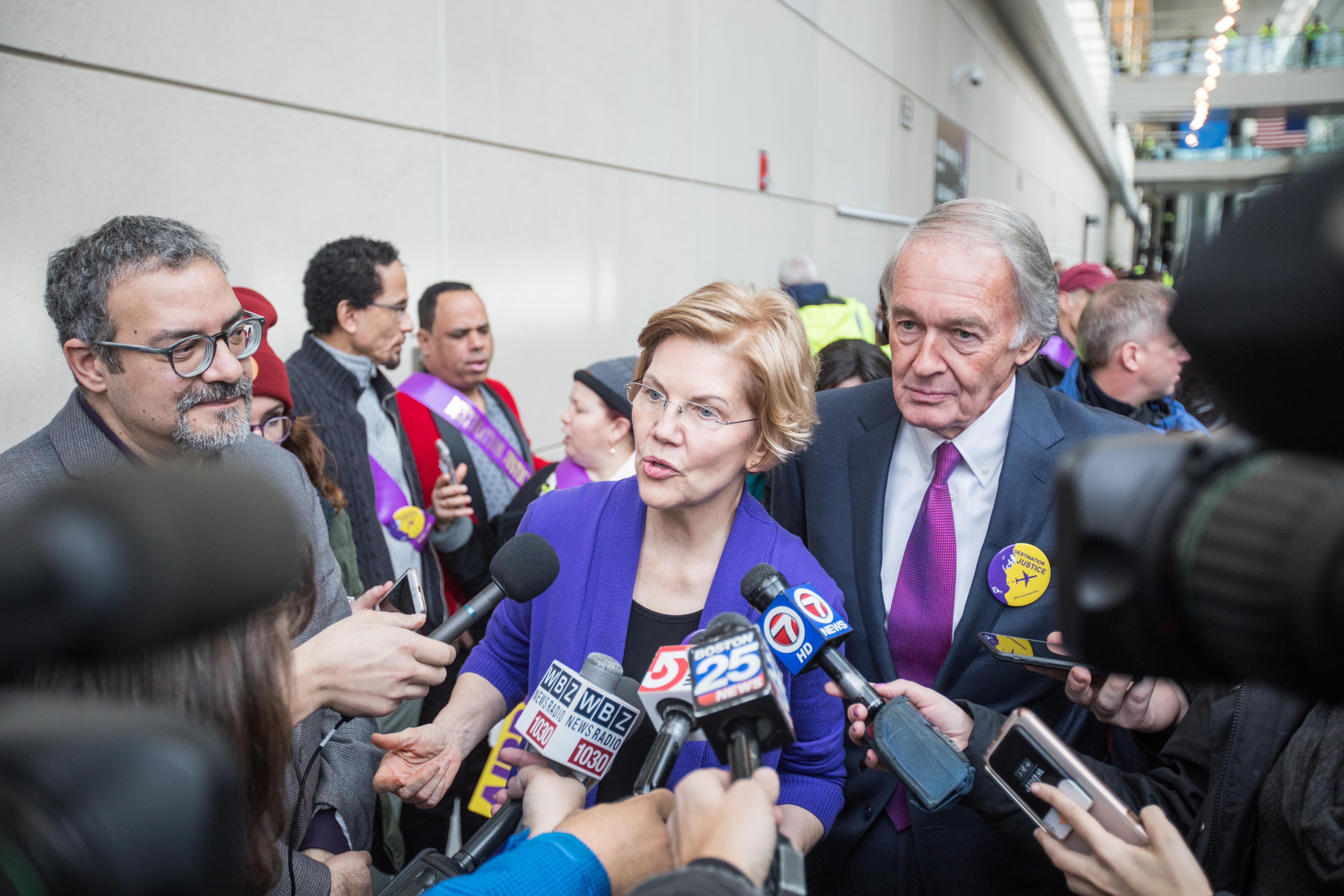 BOSTON, MA - JANUARY 21:  Sen. Elizabeth Warren (D-MA) and Sen. Ed Markey (D-MA) speak to reporters following a rally for airport workers affected by the government shutdown at Boston Logan International Airport on January 21, 2019 in Boston, Massachusetts. As the partial government shutdown enters its fifth week, the stalemate between President Donald Trump and congressional Democrats continues as they cannot come to a bipartisan solution on border security.  (Photo by Scott Eisen/Getty Images)