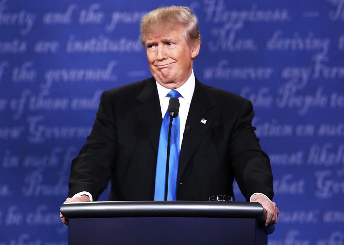 Republican presidential nominee Donald Trump makes a face during the Presidential Debate at Hofstra University on September 26, 2016 in Hempstead, New York.  