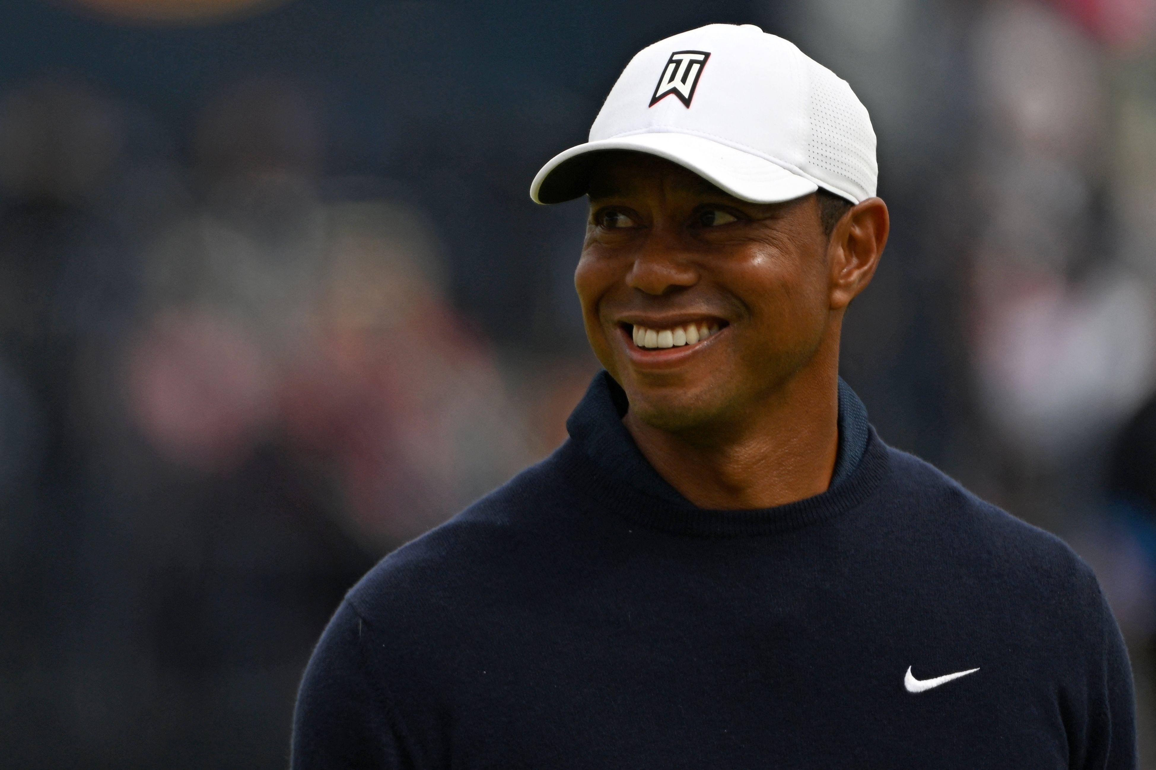 Woods smiling on the course