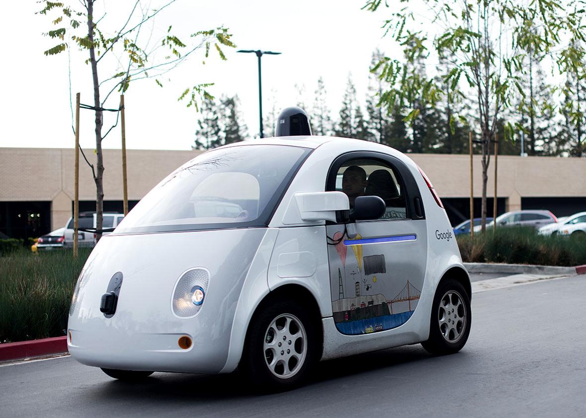 A self-driving car traverses a parking lot at Google's headquarters in Mountain View, California on January 8, 2016. 