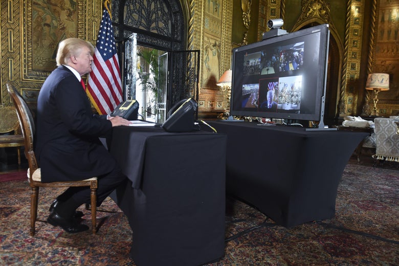 President Donald J. Trump participates in a video teleconference call with military members on Christmas Eve in Palm Beach, Florida on December 24, 2017.