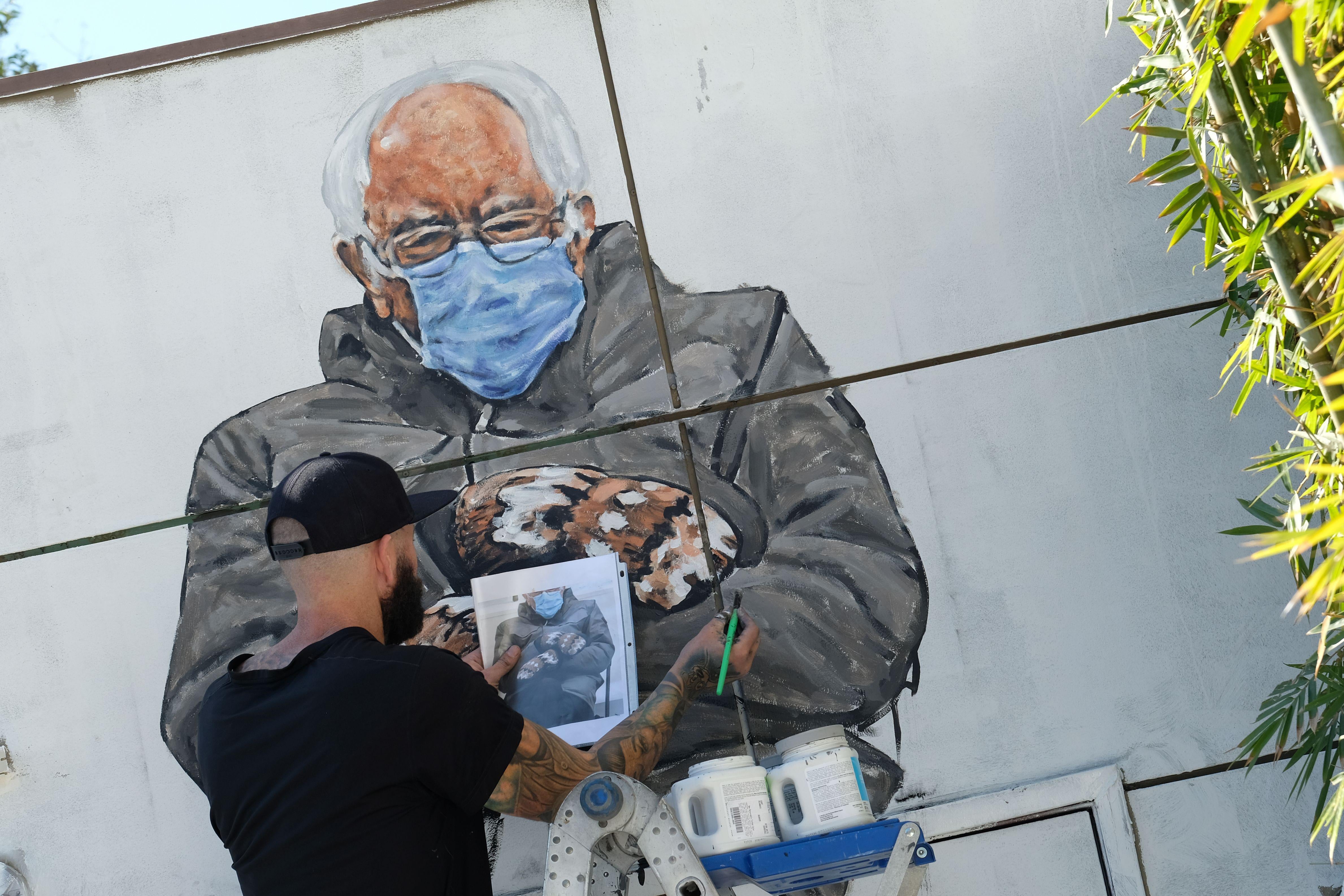 Jonas Never (@never1959) paints a mural of Senator Bernie Sanders in Culver City, California on January 24, 2021. 