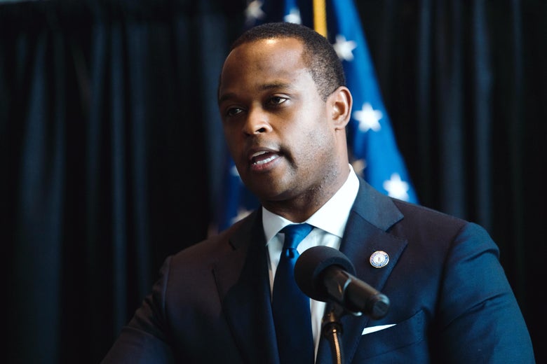 Daniel Cameron speaking at a podium