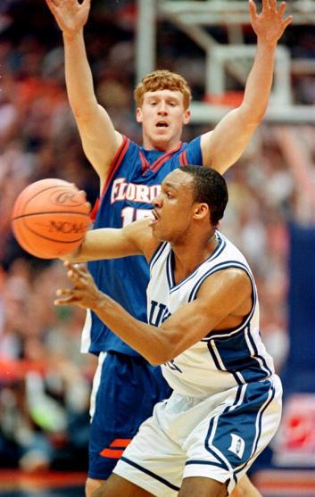 Chris Carrawell #23 of Duke passes the ball as Florida's Matt Bonner #15 of Florida.