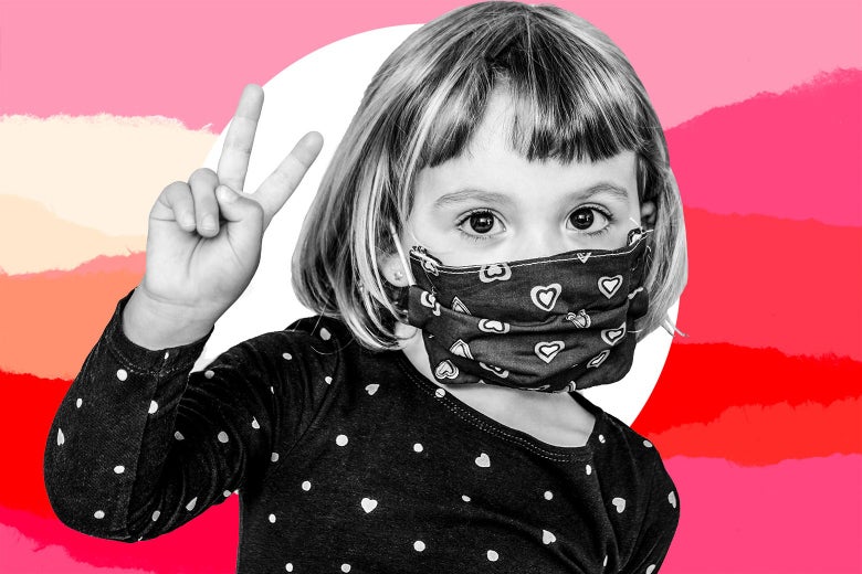 A preschool age child wears a mask.