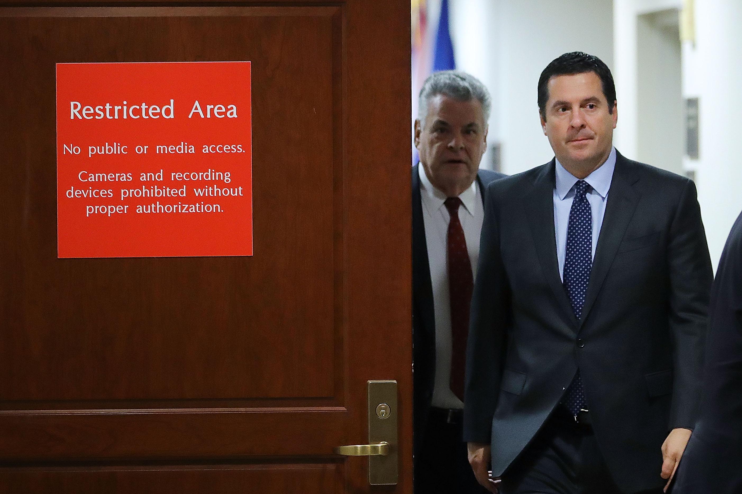 House Intelligence Committee Chairman Devin Nunes and Rep. Peter King (R-NY) leave the committee's secure meeting rooms in the basement of the U.S. Capitol House Visitors Center.