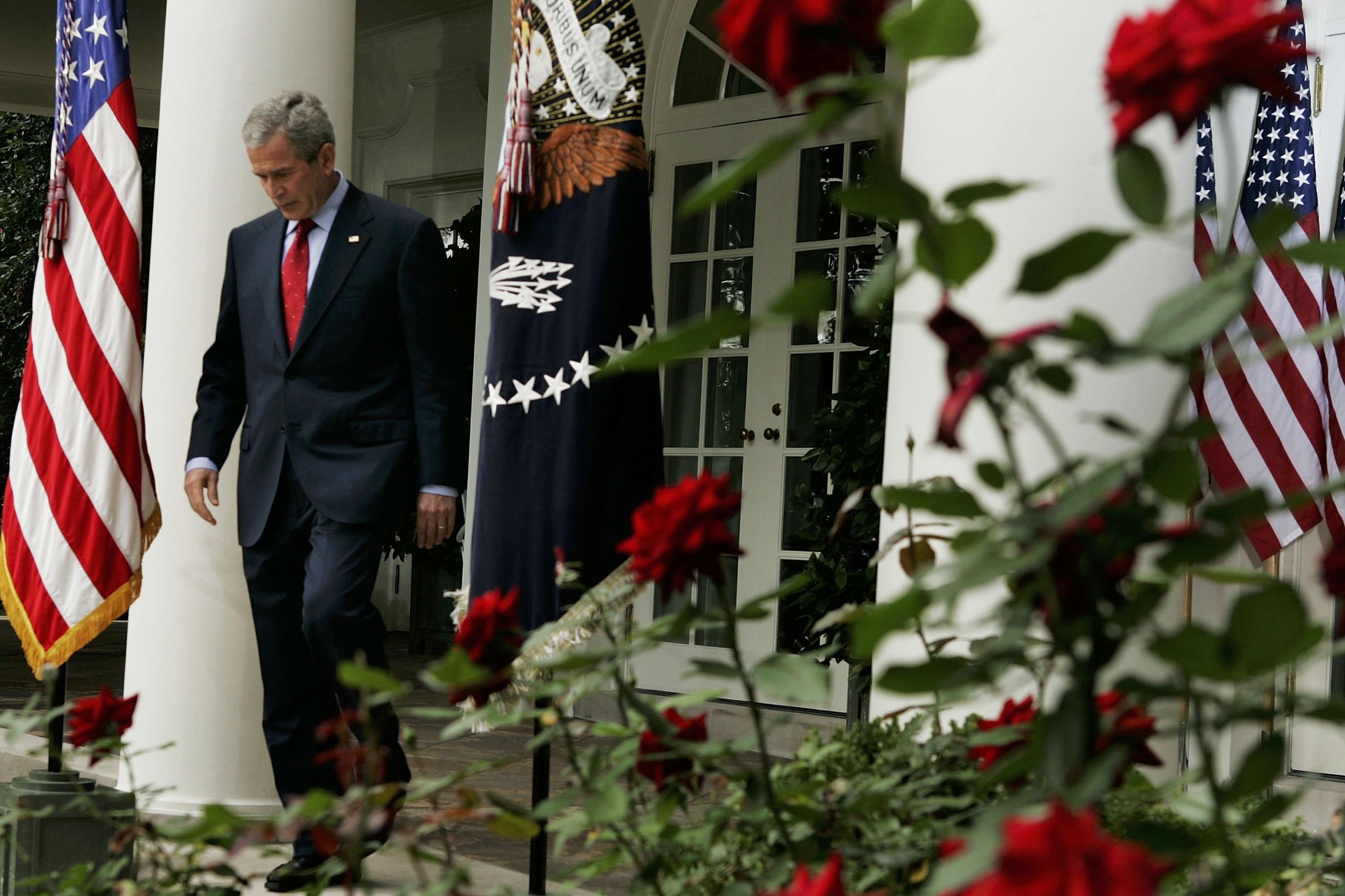 President George W. Bush walks into the Rose Garden before a news conference at the White House in October 2005. 