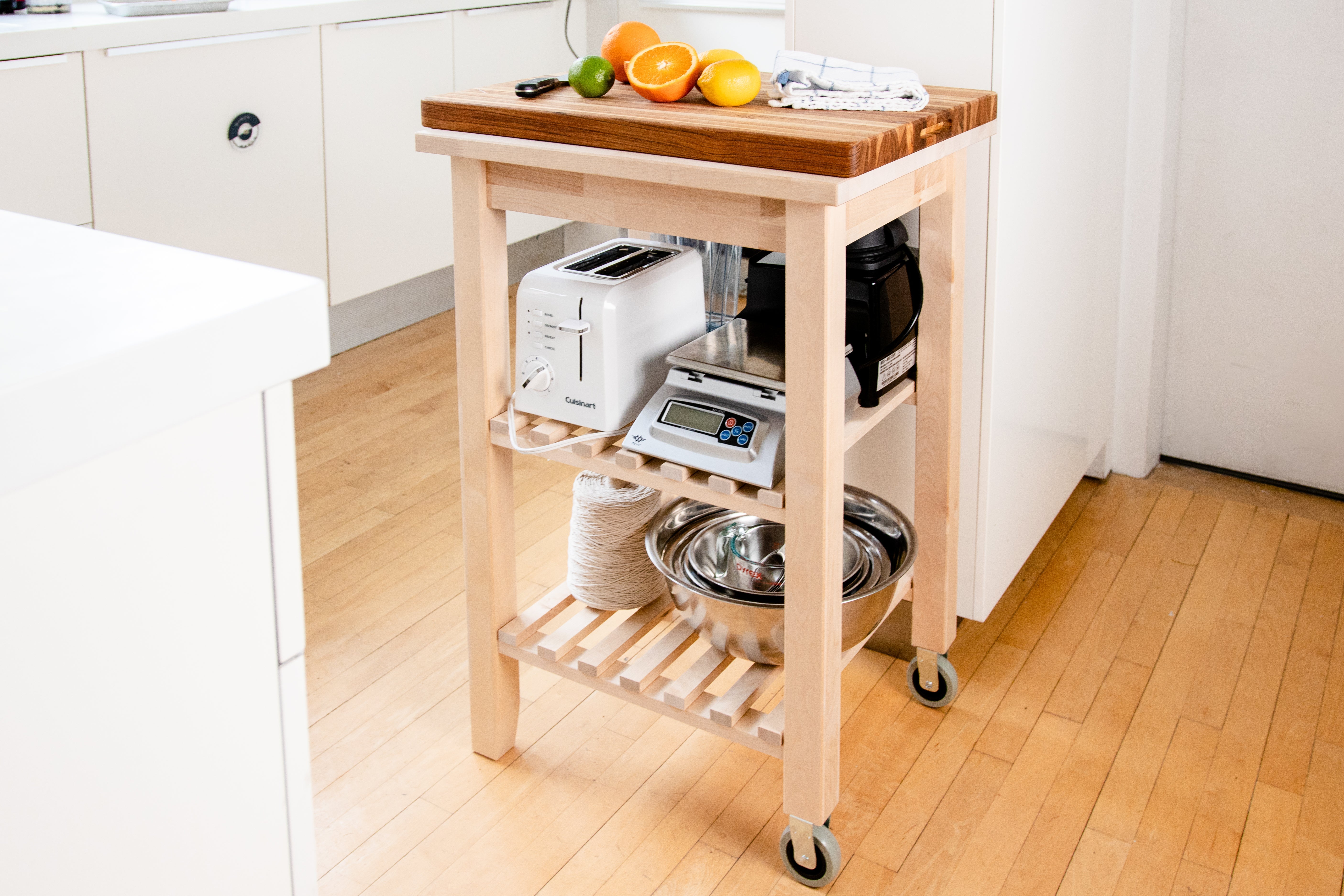 IKEA cart with shelves for storing equipment.