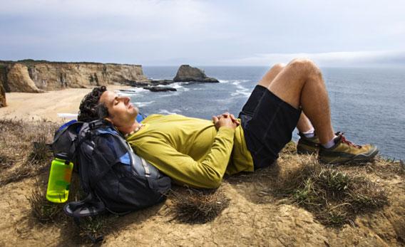 Hiker resting outdoors.
