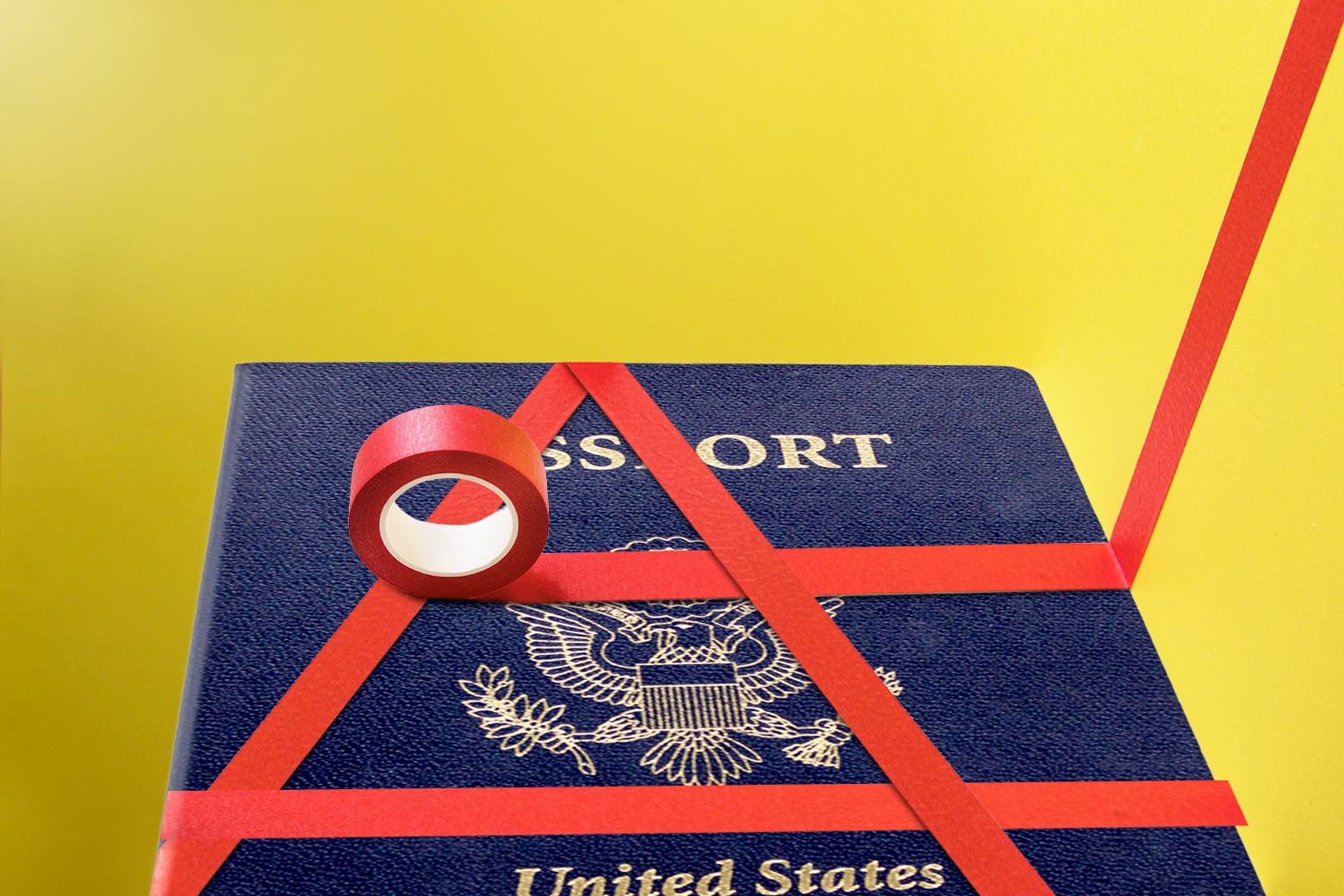 A U.S. passport with red tape on it.