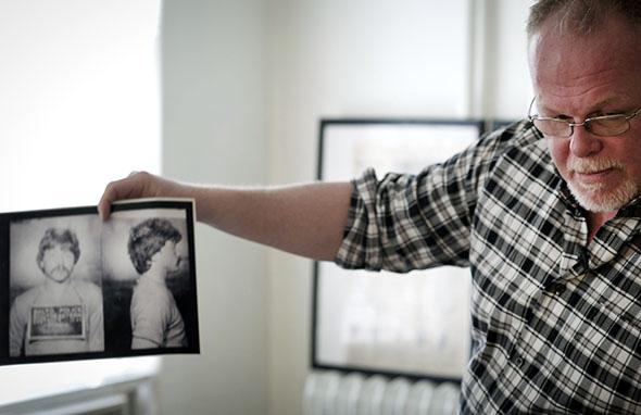 Kirk Bloodsworth shows pictures of the convicted murderer Kimberly Shay Ruffner during an AFP interview in his apartment in Mount Rainier, Maryland, on Sept. 26, 2012. Bloodsworth was the first American sentenced to death row who was exonerated by DNA fingerprinting